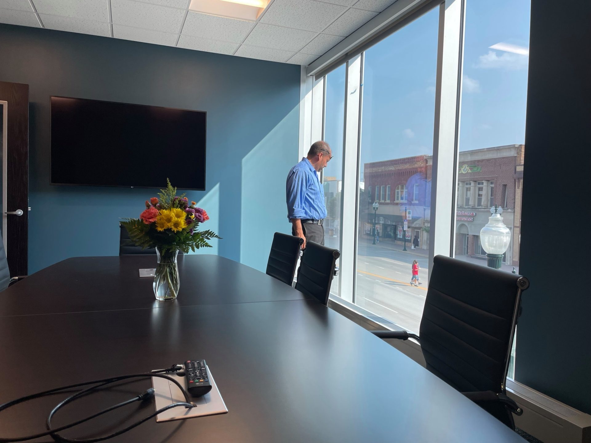 Architect Andy Engan surveys the city from a new multi-media conference room.